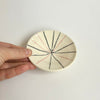 Small black and pink fireworks plate