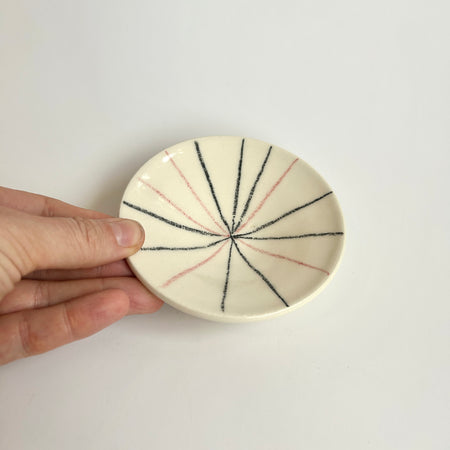 Small black and pink fireworks plate