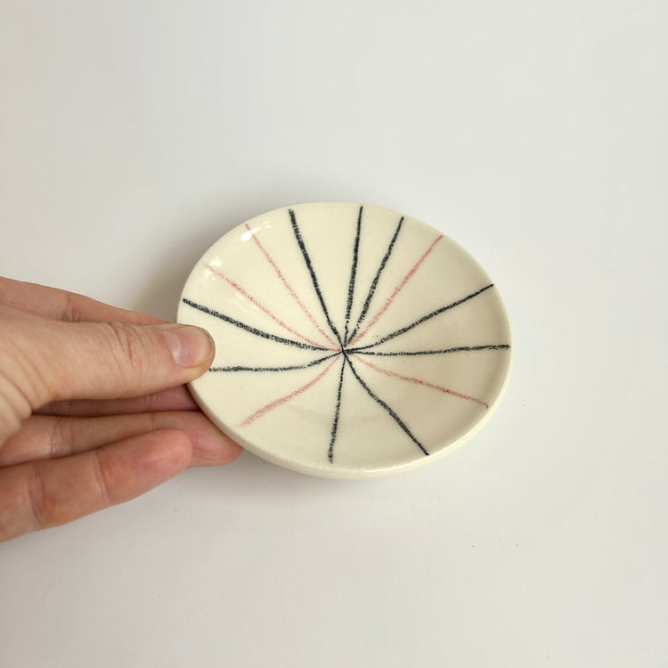 Small black and pink fireworks plate