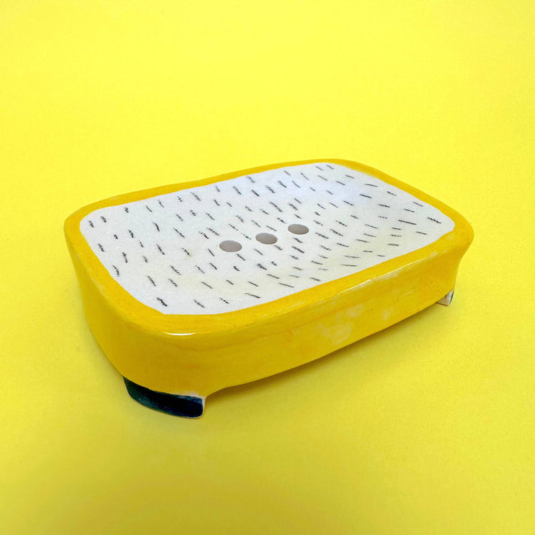 Yellow ceramic soap dish
