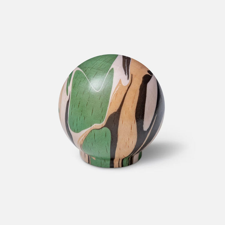 Green marbled handle (or hook) on wood