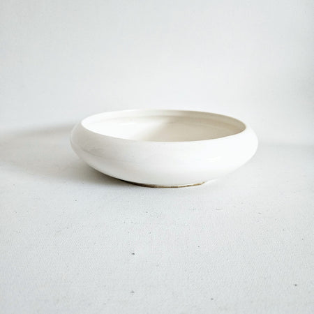 Vintage round ceramic pocket emptier