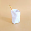 Crumpled ceramic cup