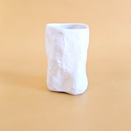 Crumpled ceramic cup