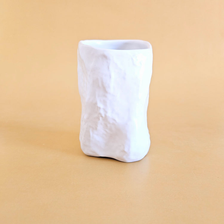 Crumpled ceramic cup