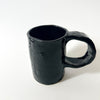 Tasse noire texturée en céramique