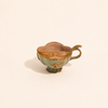 Tasse à thé verte avec protège moustache