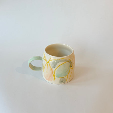 Tasse abstraite verte et jaune