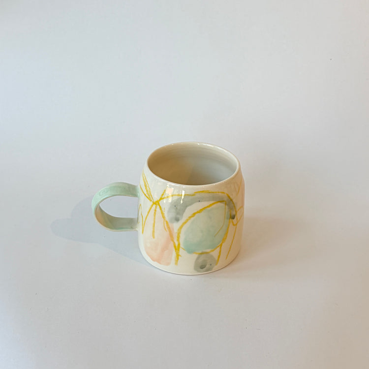Tasse abstraite verte et jaune