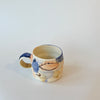 Tasse abstraite bleue et pêche