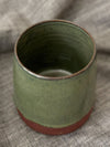 Green vase in red clay