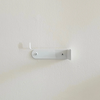 Compact white toilet paper holder 