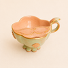Tasse à thé verte avec protège moustache