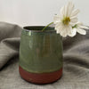Green vase in red clay