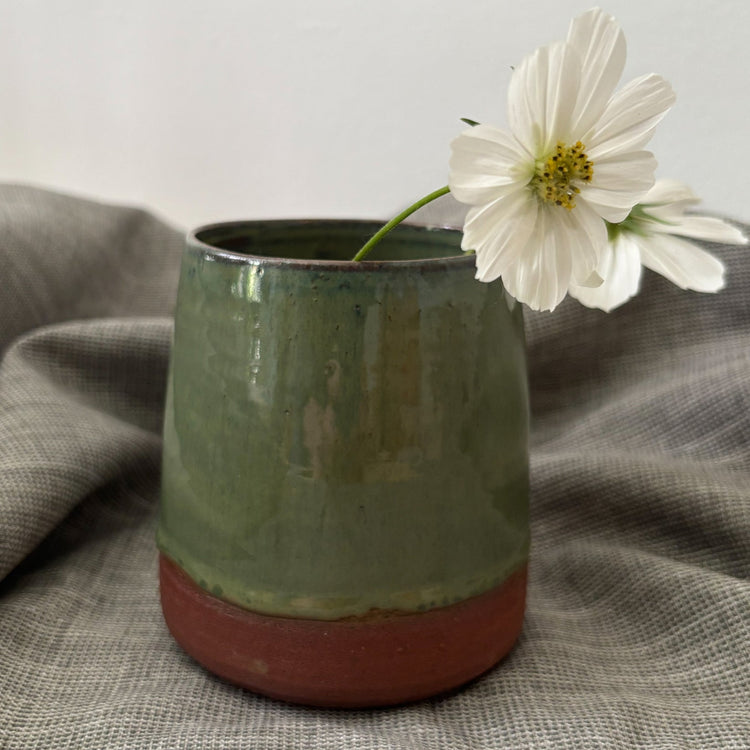 Green vase in red clay