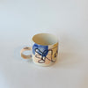 Tasse abstraite bleue et pêche