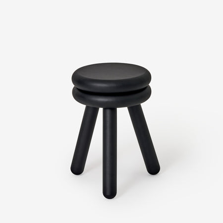 Large black Pluma wooden stool 