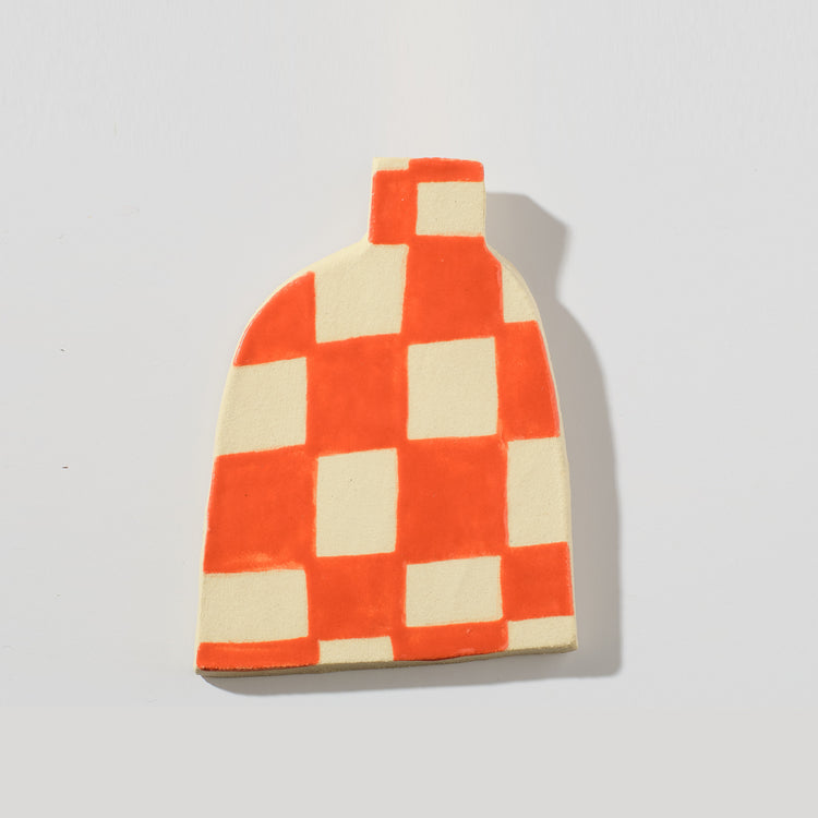 Wall-mounted red checkered vase