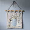 Floral textile wall hanging