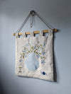 Floral textile wall hanging