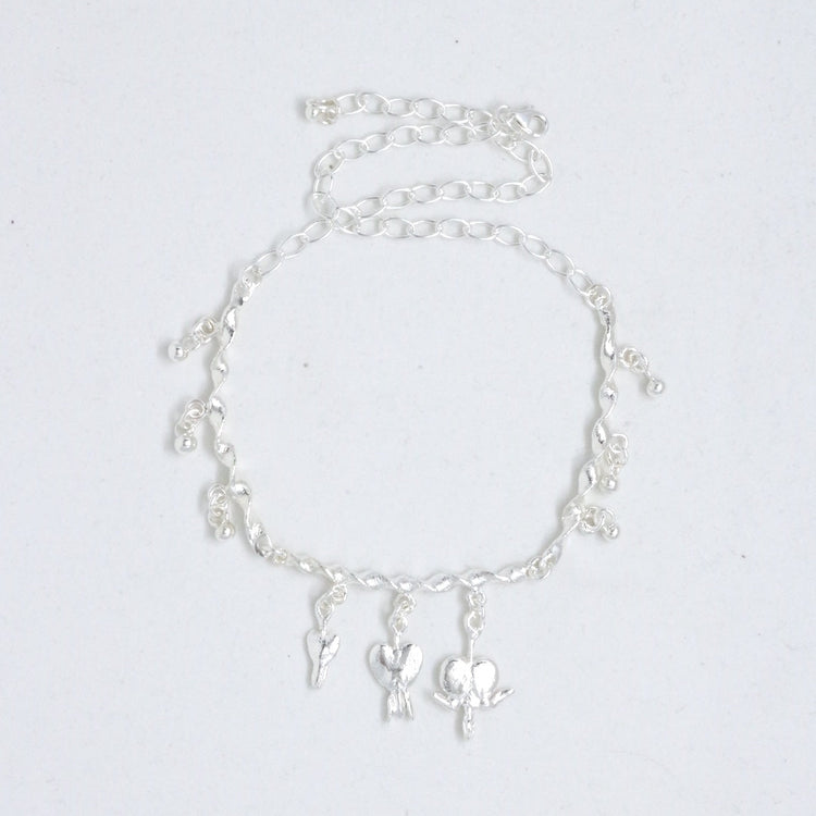 Necklace with drop and bleeding heart charms
