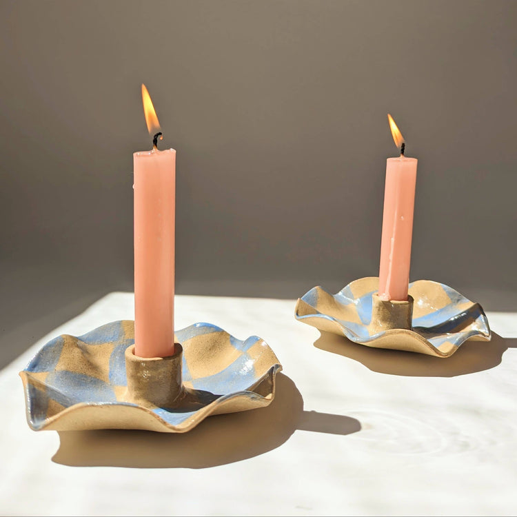 Wavy candlestick with blue checks