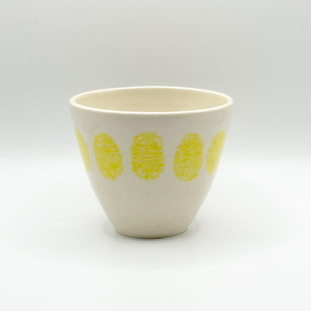 Yellow round ceramic cups