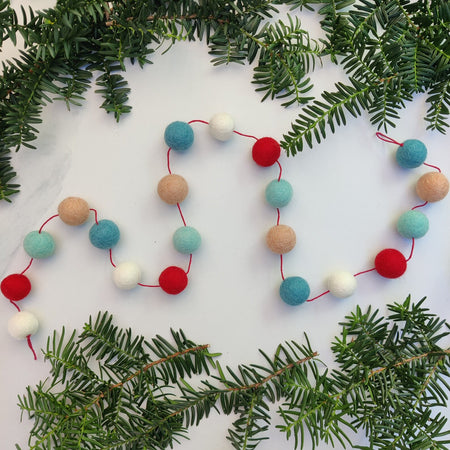 Garland of white felted wool balls 