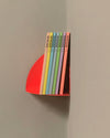 Neon red corner shelf