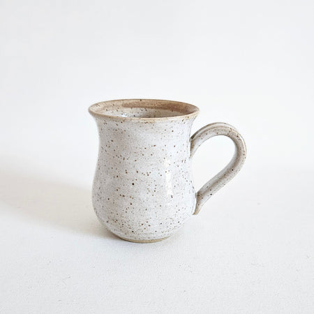 Handcrafted ceramic mug with spots